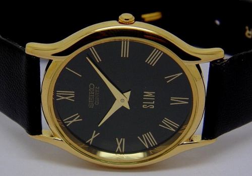 Reloj Seiko Quartz Super Slim Chapado En Oro Esfera Negra