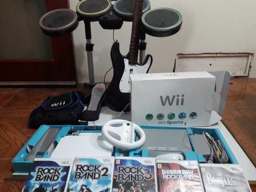 Nintendo Wii 1 Control + 5 Rockband + Mario Kart.
