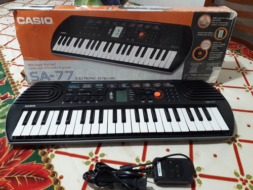 Piano Casio Original Modelo Sa 77 Con Su Adaptador Y Caja